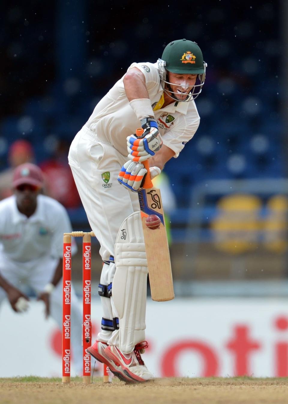 Australian batsman Michael Hussey plays a shot during the second day of the second-of-three Test matches between Australia and West Indies April 16, 2012 at Queen's Park Oval in Port of Spain. AFP PHOTO/Stan HONDA (Photo credit should read STAN HONDA/AFP/Getty Images)