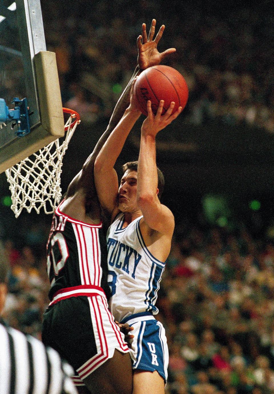 University of Kentucky guard Rex Chapman is stopped on his way to the basket by University of Cincinnati defender Levertis Robinson, during first half action of their game, Dec. 1, 1987 in Lexington.