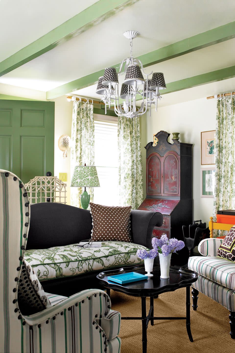 living room with green painted beams