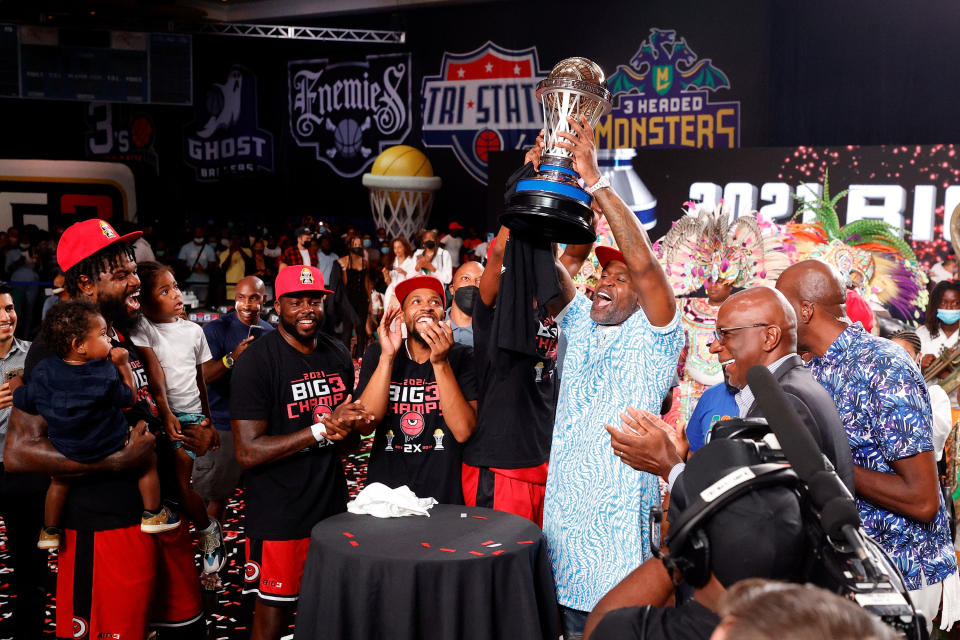 Big3 Champions celebrate their win with confetti, a trophy, applause, family, and friends.