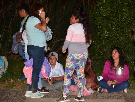 People outside their houses are seen along a street after an earthquake in Coquimbo, Chile January 19, 2019. Picture taken January 19, 2019. REUTERS/Alejandro Pizarro