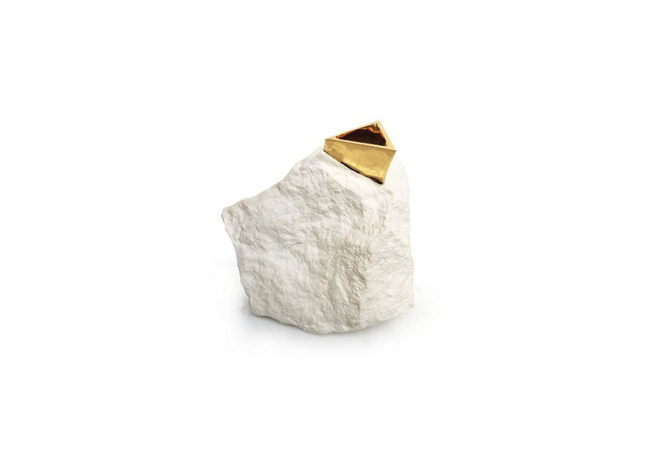 Cast from an actual rock with a 22-karat gold mouth, this vase is just the right mix of understated and ornate.