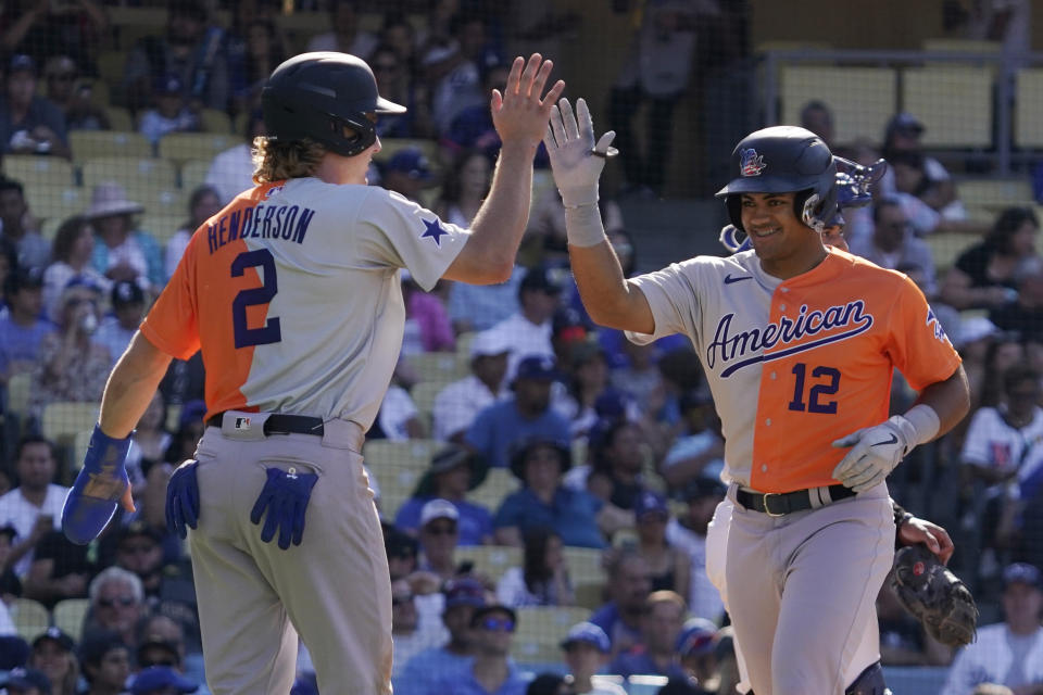 American League's Jasson Dominguez, right, celebrates his home run with Gunnar Henderson during the third inning of the MLB All-Star Futures baseball game, Saturday, July 16, 2022, in Los Angeles. (AP Photo/Mark J. Terrill)