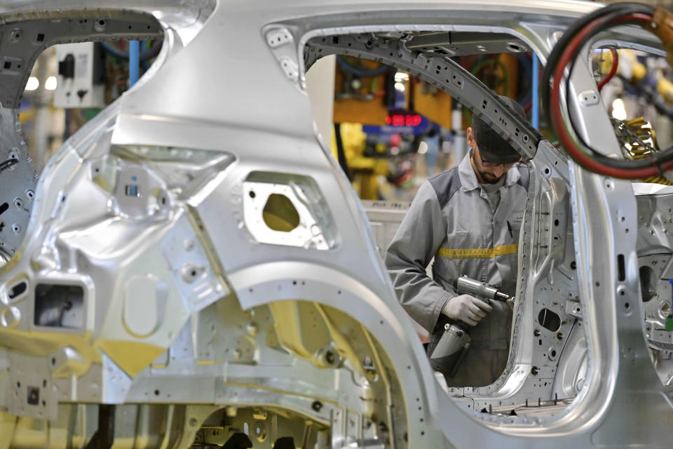 Worker assemble vehicle parts on a production line inside Renault factory, on the outskirts of Tangier, Morocco, Monday, April 29, 2024. Morocco has grown into a car manufacturing juggernaut over the past fifteen years, positioning itself strategically between East and West as the automotive industry transitions to electric vehicles. The country supplies more cars to Europe than China, India or Japan through new highways and an expanded port in Tangier. (AP Photo)