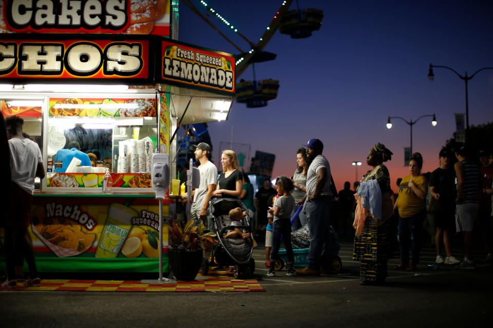 Fairgoers wait in line for food at the OKC Fairgrounds during a previous year's Oklahoma State Fair.