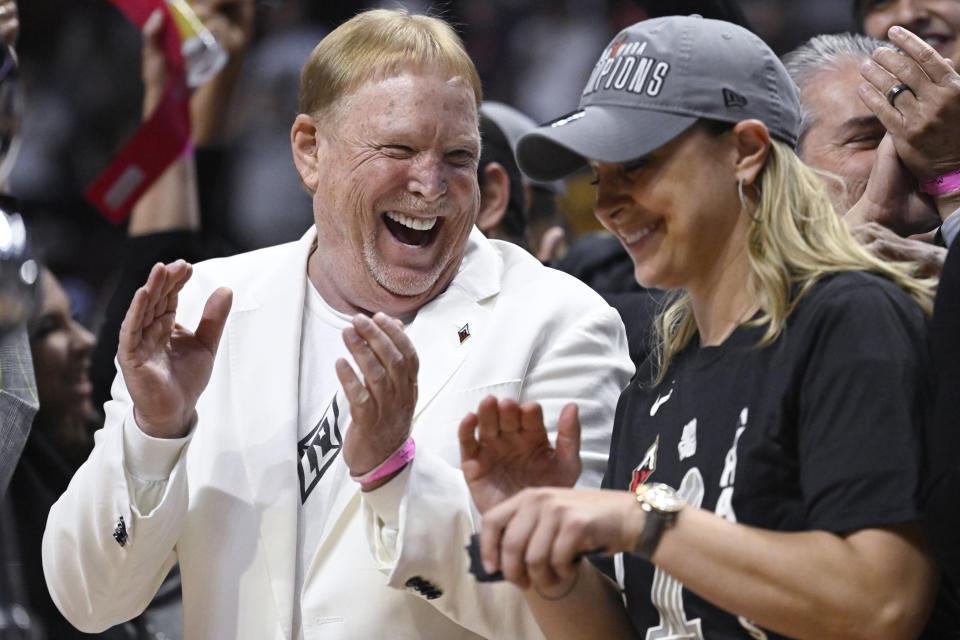 Las Vegas Aces owner Mark Davis, celebrates his team's win with Las Vegas Aces head coach Becky Hammon in the WNBA basketball finals against the Connecticut Sun, Sunday, Sept. 18, 2022, in Uncasville, Conn. (AP Photo/Jessica Hill)