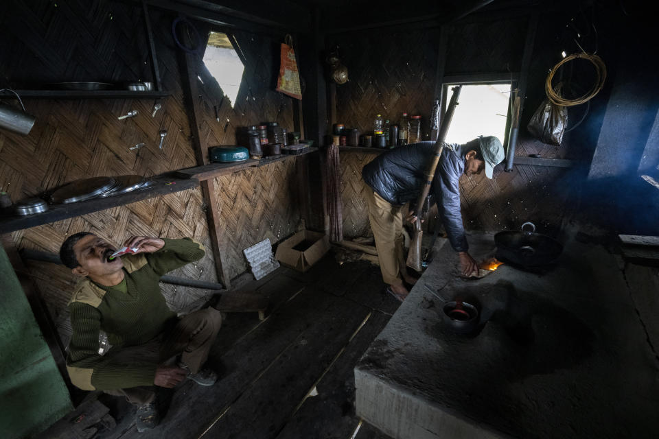 Forest officers prepare food for enumerators and observers who are part of a census drive to count one-horned rhinoceros' in Kaziranga national park, in the northeastern state of Assam, India, Saturday, March 26, 2022. Nearly 400 men using 50 domesticated elephants and drones scanned the park’s 500 square kilometers (190 square miles) territory in March and found the rhinos' numbers increased more than 12%, neutralizing a severe threat to the animals from poaching gangs and monsoon flooding. (AP Photo/Anupam Nath)