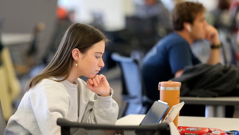 A University of Utah student studies in the J. Willard Marriott Library at the University of Utah in Salt Lake City on Wednesday, March 13, 2024. Tuition and fees will go up at all degree-granting colleges and universities in the Utah System of Higher Education.
