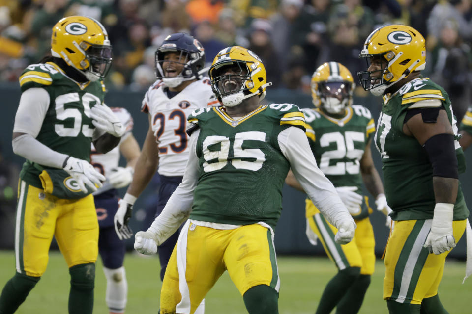 Green Bay Packers defensive tackle Devonte Wyatt (95) celebrates after sacking Chicago Bears quarterback Justin Fields during the first half of an NFL football game Sunday, Jan. 7, 2024, in Green Bay, Wis. (AP Photo/Mike Roemer)