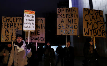 People gather to protest against plans to further restrict abortion laws in front of the Parliament in Warsaw, Poland January 13, 2018. REUTERS/Kacper Pempel