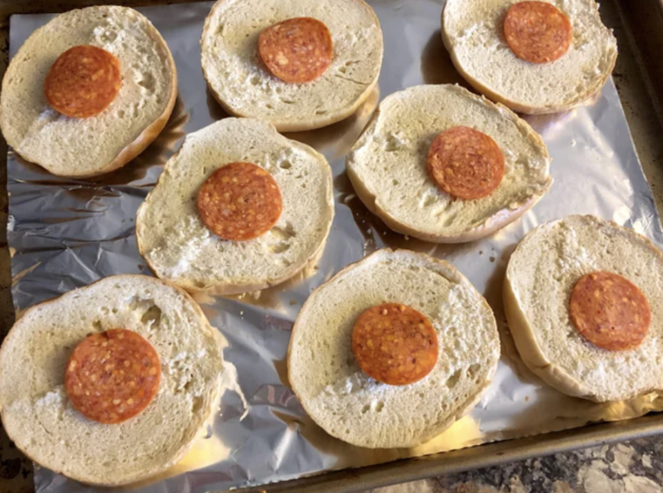 bagel slices with pepperoni in the middle