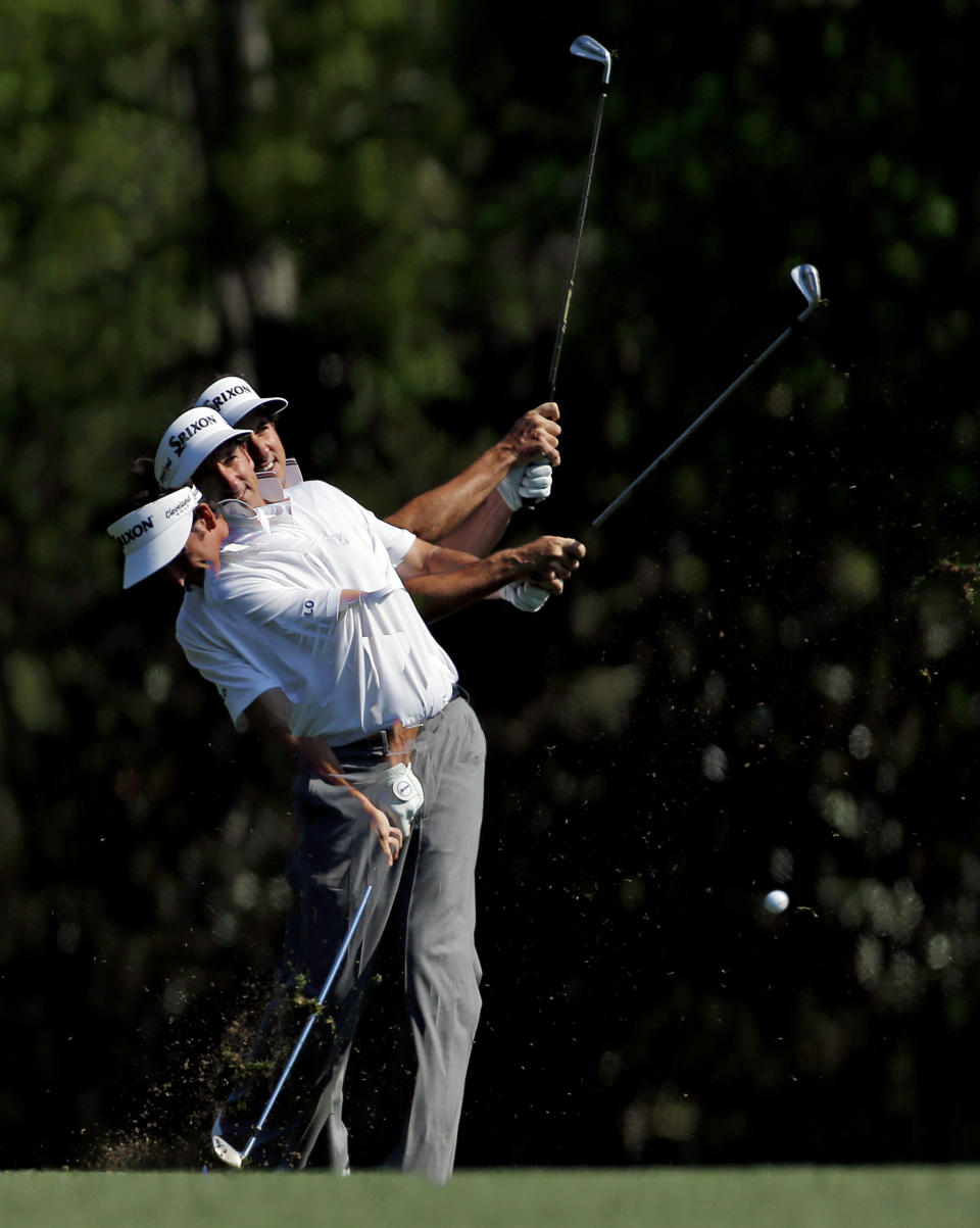 In a photo taken with a multiple exposure, Gonzalo Fernandez-Castano, of Spain, hits off the fifth fairway during the second round of the Masters golf tournament Friday, April 11, 2014, in Augusta, Ga. (AP Photo/Matt Slocum)