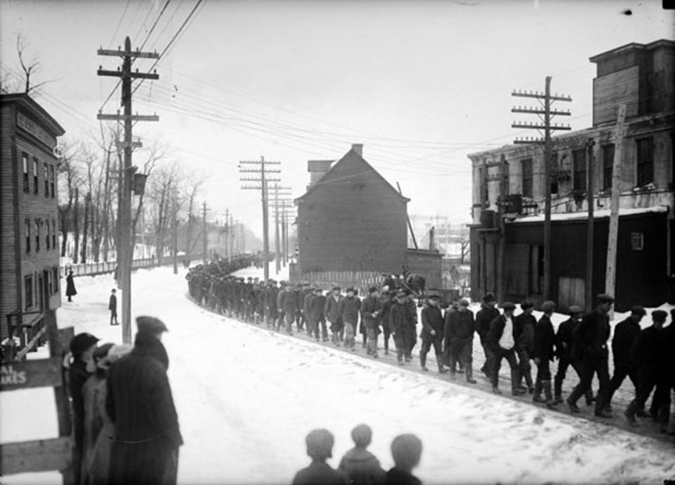 Thousands of striking sealers march down Water Street West in St. John's in March 1902. Courtesy of The Rooms.