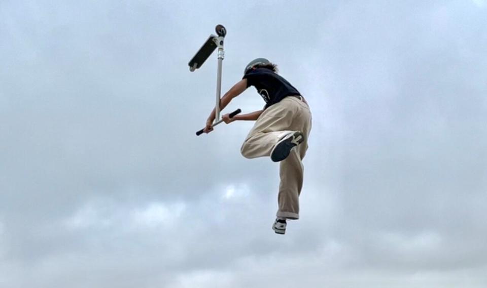 Kage Schafers flies through the air above Chinook Winds Skatepark in Airdrie, practicing for the North American Scooter Finals in California.