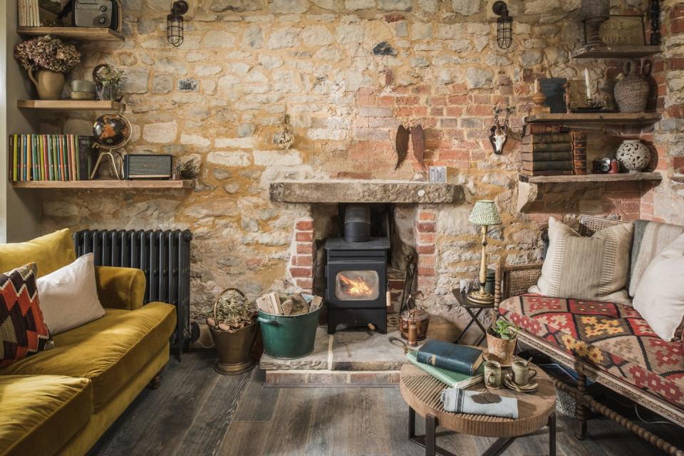 thatched cottage with log burner and cosy sofas