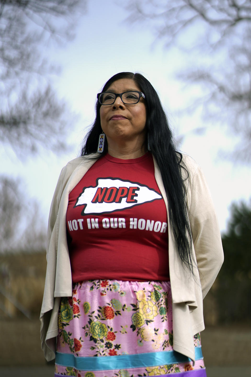 Rhonda LeValdo poses Tuesday, Feb. 6, 2024, in Lawrence, Kan. The Kansas City Chiefs, her hometown team and the focus of her protest, are playing in the Super Bowl this weekend. Levaldo is renewing her call for the team to change its name and ditch its logo and gametime rituals that she and other activists say are offensive. (AP Photo/Ed Zurga)