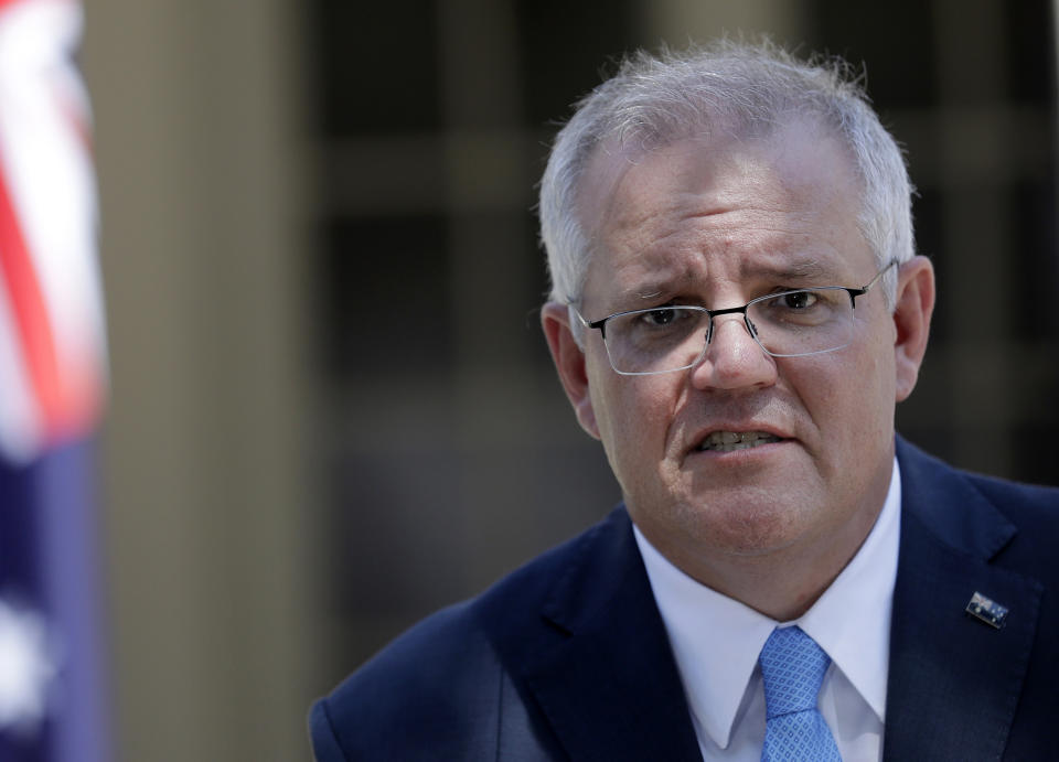 Australia's Prime Minister Scott Morrison speaks to the media in Sydney, Monday, March 1, 2021. Morrison stood by an unnamed Cabinet minister against calls for him to step down from office over an allegation that he raped a 16-year-old girl more than 30 years ago. (AP Photo/Rick Rycroft)