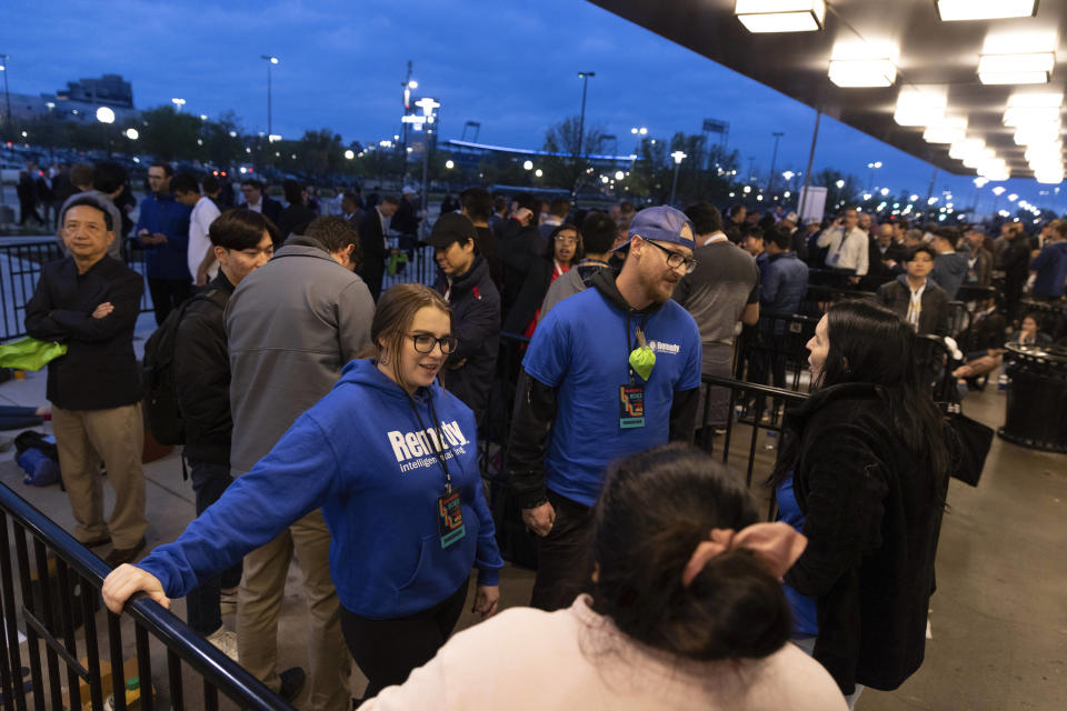 From left, Liz McKenzie, Cody Mann, Mallory Carnley and Genesis Ventura, foreground, all from Omaha, wait at the front of the line to enter the Berkshire Hathaway annual meeting on Saturday, May 6, 2023, in Omaha, Neb. Mann arrived at 2 a.m. to secure his spot at the front. (AP Photo/Rebecca S. Gratz)