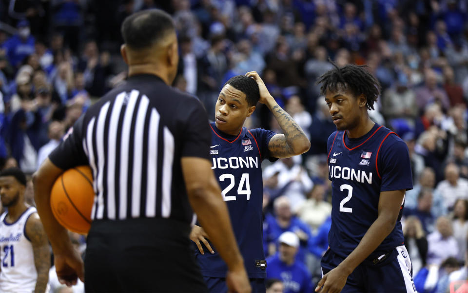 UConn guards Jordan Hawkins (24) and Tristen Newton (2) react after foul call during the second half of the team's NCAA college basketball game against Seton Hall in Newark, N.J., Wednesday, Jan. 18, 2023. Seton Hall won 67-66. (AP Photo/Noah K. Murray)