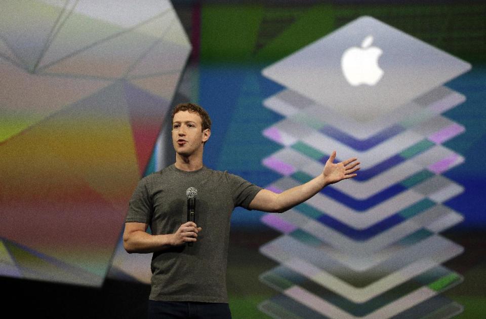 Facebook CEO Mark Zuckerberg gestures while delivering the keynote address at the f8 Facebook Developer Conference Wednesday, April 30, 2014, in San Francisco. (AP Photo/Ben Margot)