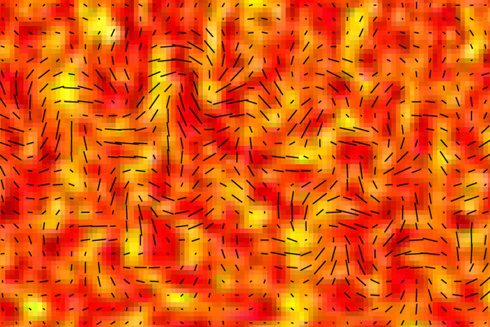 This image provided by the BICEP2 Collaboration shows slight temperature fluctuations, indicated by variations in color, of the cosmic microwave background of a small patch of sky and the orientation of its polarization, shown as short black lines. Researchers say since the cosmic microwave background is a form of light, it exhibits all the properties of light, including polarization. The changes in a particular type of polarization, indicated here, are theorized to be caused by gravitational waves. These waves are signals of an extremely rapid inflation of the universe in its first moments. (AP Photo/BICEP2 Collaboration)