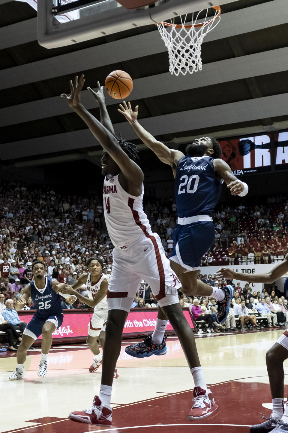 Longwood guard Walyn Napper (20) shoots next to Alabama center Charles Bediako (14) during the first half of an NCAA college basketball game Monday, Nov. 7, 2022, in Tuscaloosa, Ala. (AP Photo/Vasha Hunt)