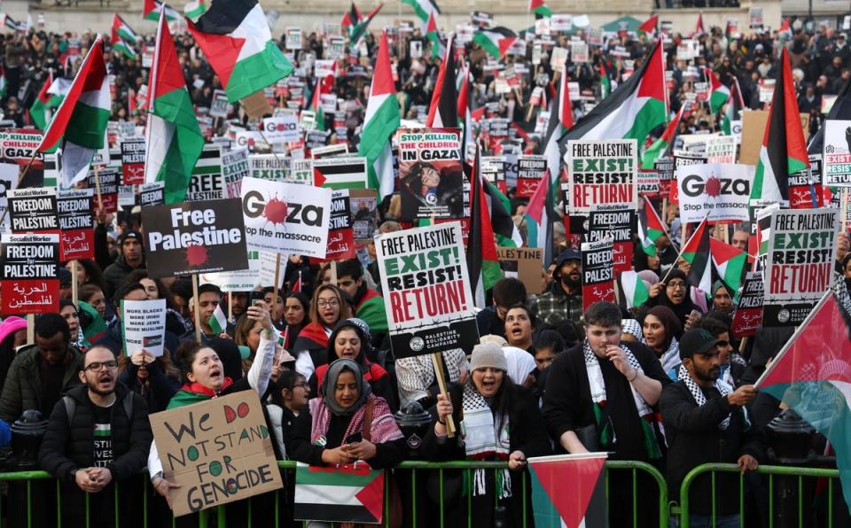 Demonstrators demanded a ‘ceasefire now’ at Trafalgar Square before joining the march (EPA)