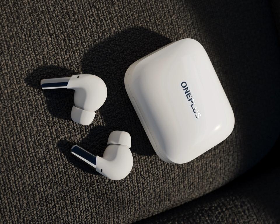 White OnePlus Buds Pro earphones with matching charging case. - Credit: OnePlus