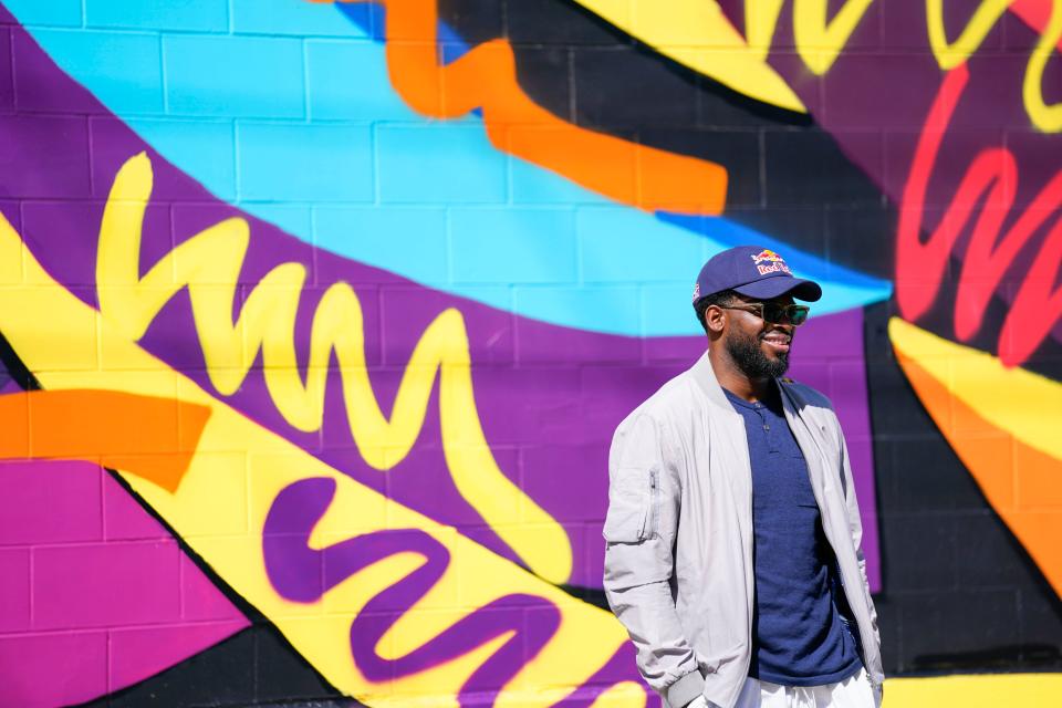 P.K. Subban of the New Jersey Devils poses in front of one of the murals painted by artists Yasmin De Jesus, Malcolm Rolling, and Matthew Purefoy around the Sharpe James Kenneth A. Gibson Recreation Center.