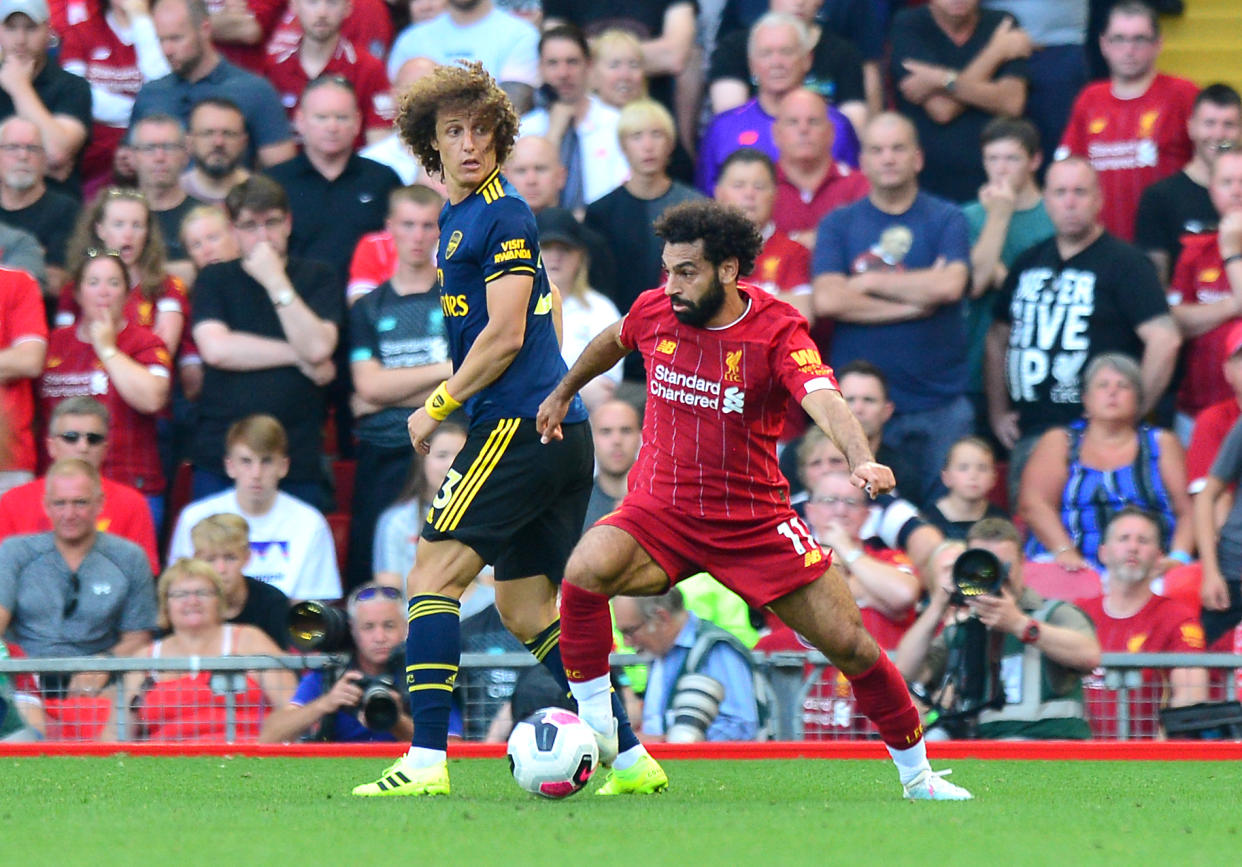 Arsenal's David Luiz (left) and Liverpool's Mohamed Salah battle for the ball during the Premier League match at Anfield, Liverpool. (Photo by Anthony Devlin/PA Images via Getty Images)