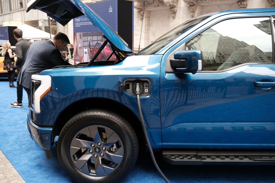A Ford electric F-150 truck is displayed outside of the New York Stock Exchange (NYSE) on March 23, 2023, in New York City.