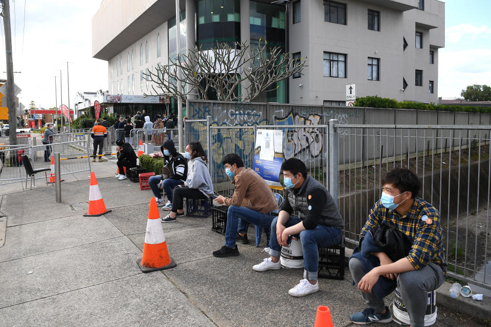 People are seen lining up at a pop-up Covid vaccination clinic at the Lebanese Muslim Association in Lakemba. Source: AAP