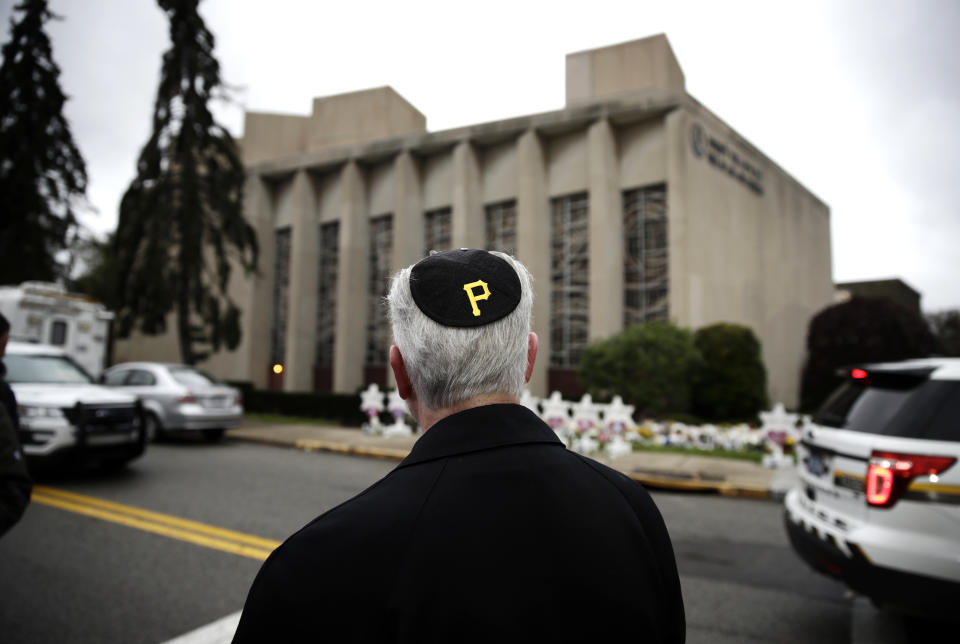 Rabbi Jeffrey Myers of the Tree of Life synagogue stands outside the Pittsburgh temple wearing a yarmulke with a Pittsburgh Pirates logo on Monday. (Photo: Matt Rourke/AP)