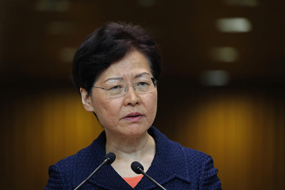 Hong Kong Chief Executive Carrie Lam listens to reporters' questions at a press conference in Hong Kong Tuesday, Aug. 20, 2019. Lam said she’s setting up a “communication platform” to resolve differences in the Chinese city, which has been wracked by months of chaotic anti-government protests. She also said a fact-finding study will look at the causes of the protests and the police response to them. (AP Photo/Vincent Yu)