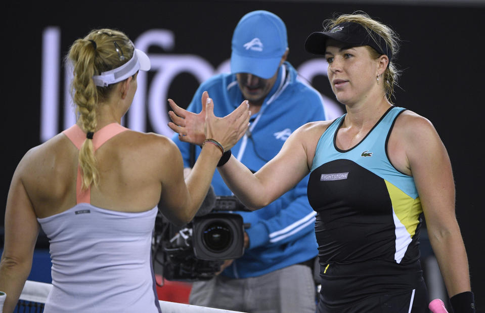 Russia's Anastasia Pavlyuchenkova, right, is congratulated by Germany's Angelique Kerber after winning their fourth round singles match at the Australian Open tennis championship in Melbourne, Australia, Monday, Jan. 27, 2020. (AP Photo/Andy Brownbill)
