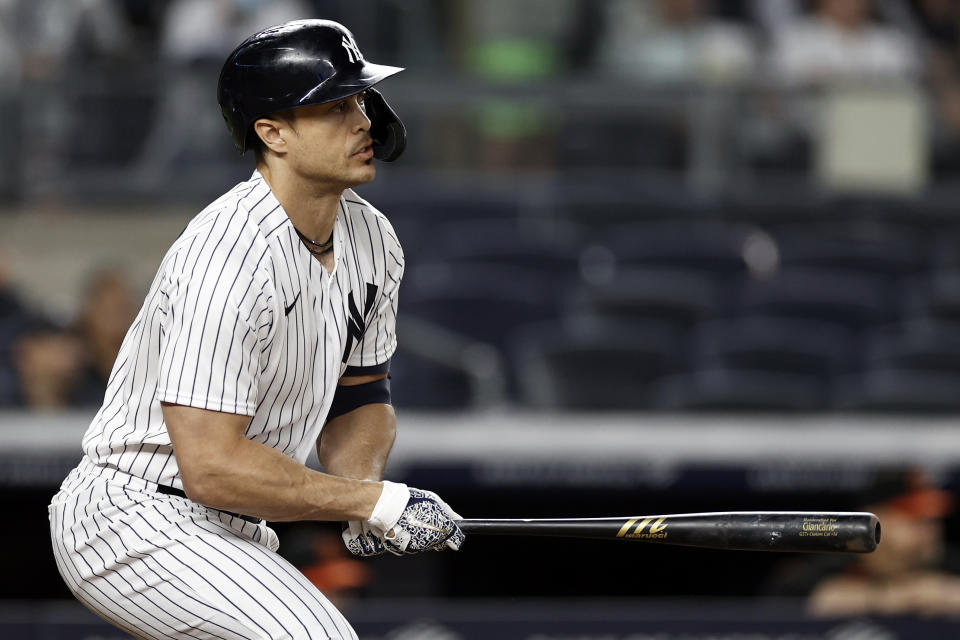 New York Yankees' Giancarlo Stanton watches his walkoff single during the 11th inning of a baseball game against the Baltimore Orioles, Friday, Sept. 3, 2021, in New York. (AP Photo/Adam Hunger)