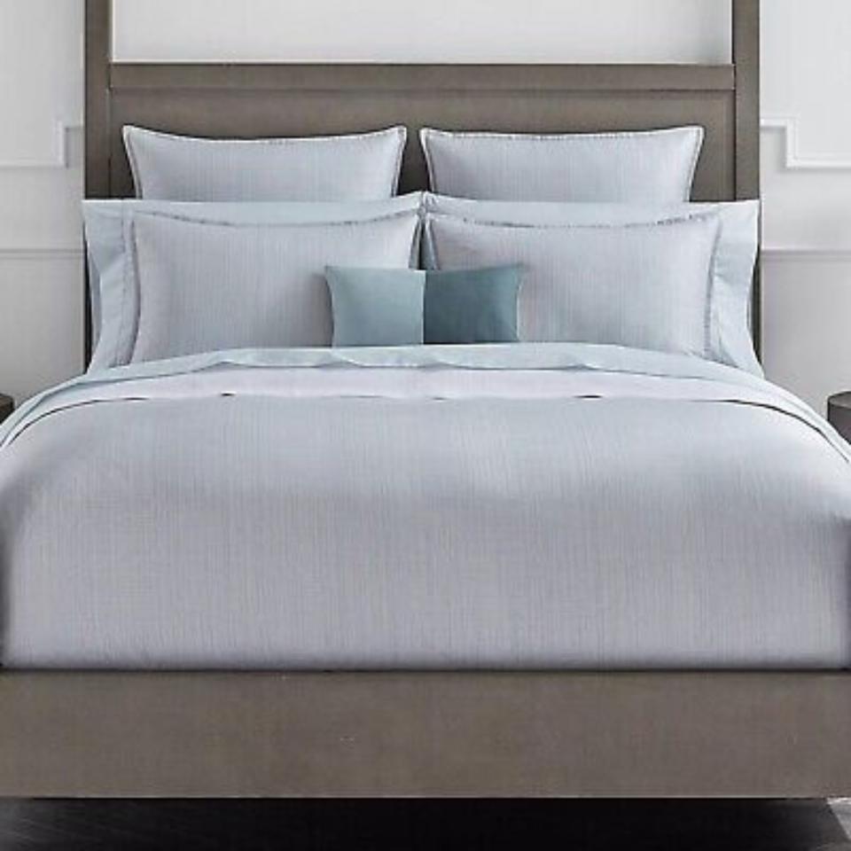 Sferra Modelli Bedding Collection on a bed.