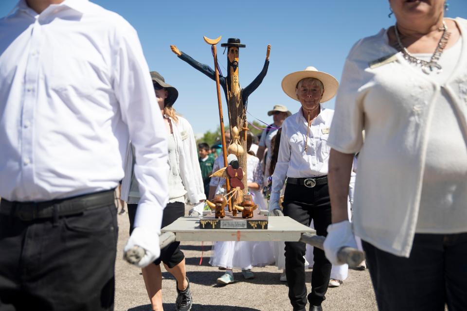 The statue of San Isidro Labrador, also known as "San Ysidro," is carried during the 22nd annual Blessing of the Fields at New Mexico Farm & Ranch Heritage Museum on Friday, May 13, 2022.
