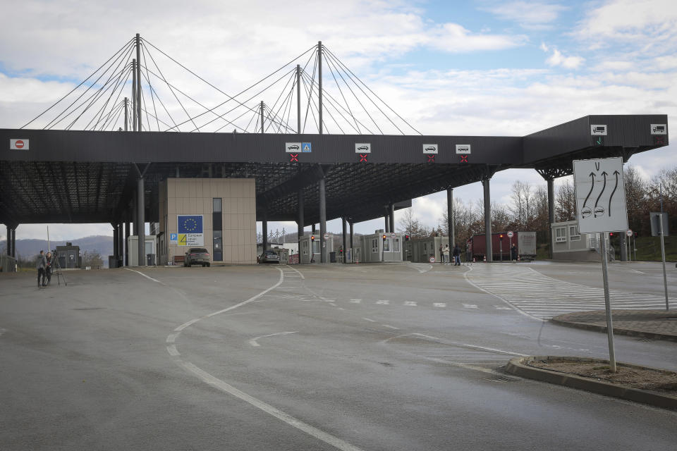 View of the closed Merdare border crossing between Kosovo and Serbia, Wednesday, Dec. 28, 2022. Kosovo closed the border crossing in Merdare, following an erected barricade by Serb protesters inside Serbia late Tuesday night, the third official border crossing closed this month following rising tensions between Kosovo and Serbia. (AP Photo/Visar Kryeziu)