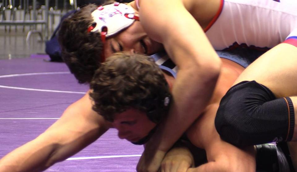 Sean-Michael Roberts of Buchanan wrestles Ross Cinfel of Clovis North at the Central Section Masters at Selland Arena in Fresno, California on Saturday, Feb. 17, 2024.