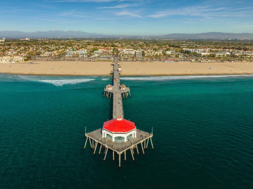 Huntington Beach pier is a popular surf spot (Visit California)