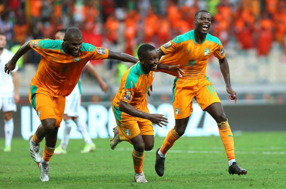 Nicolas Pépé (right) of Ivory Coast celebrates with teammates Franck Kessié (left) and Max Gradel after scoring in the impressive 3-1 defeat of Algeria.