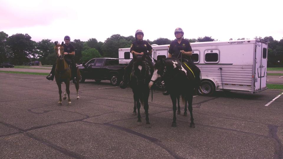 Members of the Summit County Sheriff's Office Mounted Unit prepare to search Friday for missing New Franklin resident Joseph Latona.