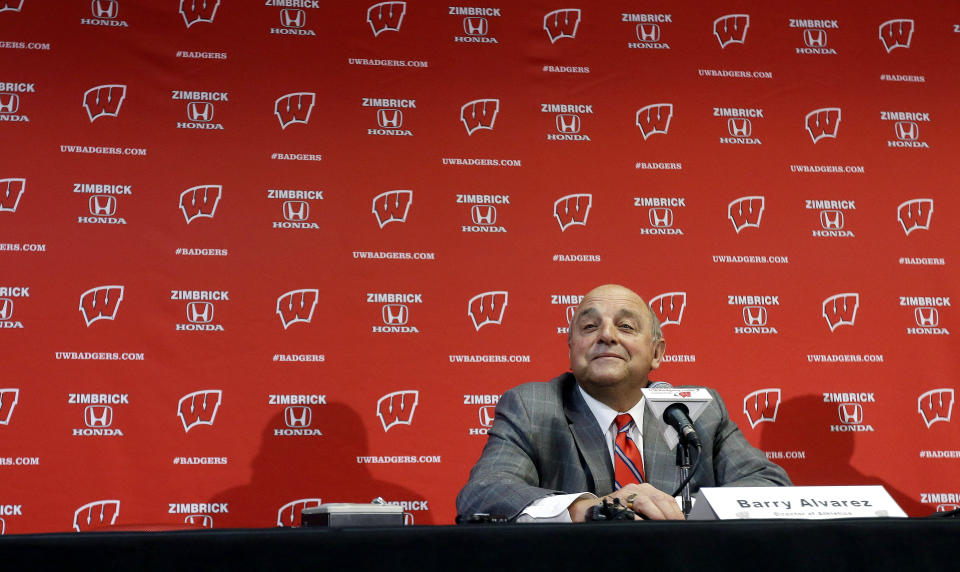 FILE - In this Dec. 6, 2012, file photo, Wisconsin Athletic Director Barry Alvarez announces that he will coach the team in this year's Rose Bowl during a news conference in Madison, Wis. The Big Ten could only fill seven of their eight predetermined bowl slots _ and each of those bowl-bound teams are currently underdogs. From the 5-loss Wisconsin team that still wound up in the Rose Bowl to the 6-6 Purdue squad that fired its coach, the beleaguered Big Ten isn’t expected to do much of anything in the postseason. (AP Photo/Morry Gash, File)