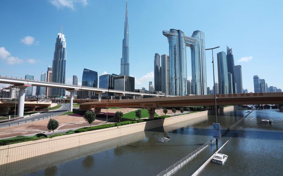 Drivers were seen swimming from their cars after the floods in Dubai