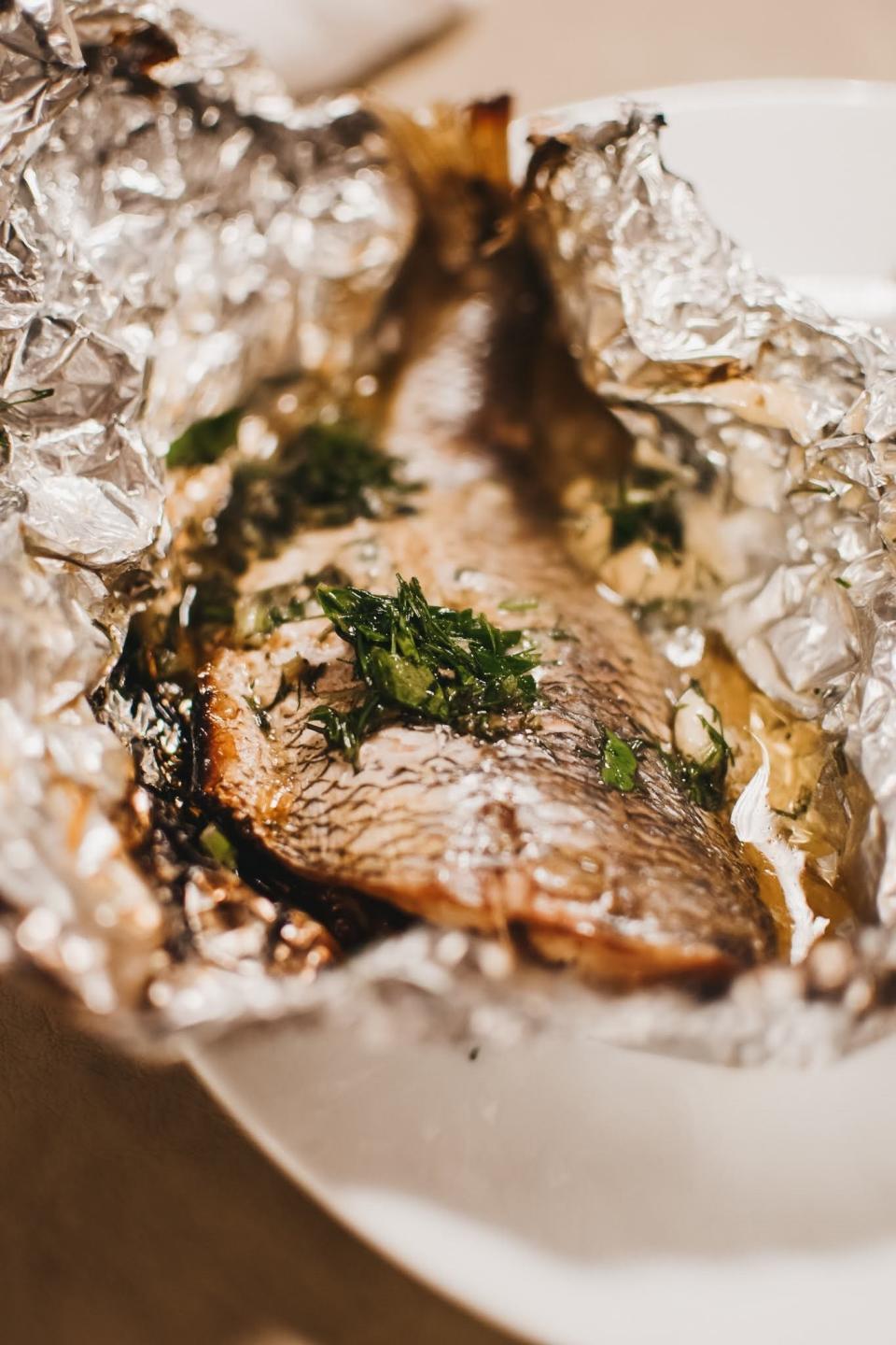 Scup fillet with herbs cooked in foil.