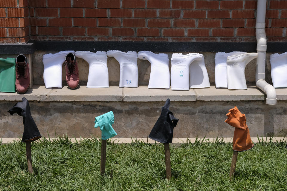 Protective equipment is laid outside to dry after being disinfected, outside the isolation section of Entebbe Regional Referral Hospital in Entebbe, Uganda Thursday, Oct. 20, 2022. Uganda's Ebola outbreak is "rapidly evolving" a month after the disease was reported in the country, a top World Health Organization official said Thursday, describing a difficult situation for health workers on the ground. (AP Photo/Hajarah Nalwadda)