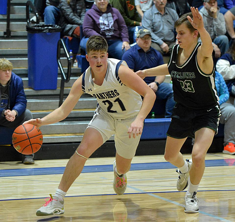 Great Plains Lutheran's Austin Rubendall heads to the hoop against Clark-Willow Lake's Aaron Zemlicka during their Region 2A quarterfinal boys basketball game on Tuesday, Febg. 27, 2024 in Watertown. Clark-Willow Lake pulled away in the fourth quarter for a 51-39 win.