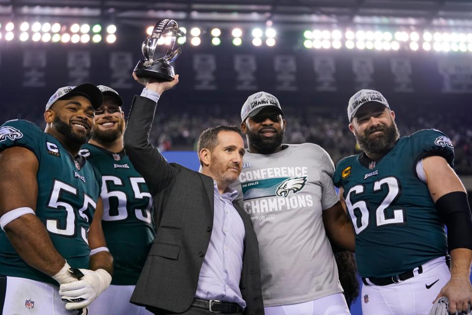 Philadelphia Eagles general manager Howie Roseman, center, stands with defensive end Brandon Graham (55) offensive tackle Lane Johnson (65), defensive tackle Fletcher Cox, and center Jason Kelce (62) after the NFC championship game against the San Francisco 49ers on Sunday, Jan. 29, 2023, in Philadelphia.