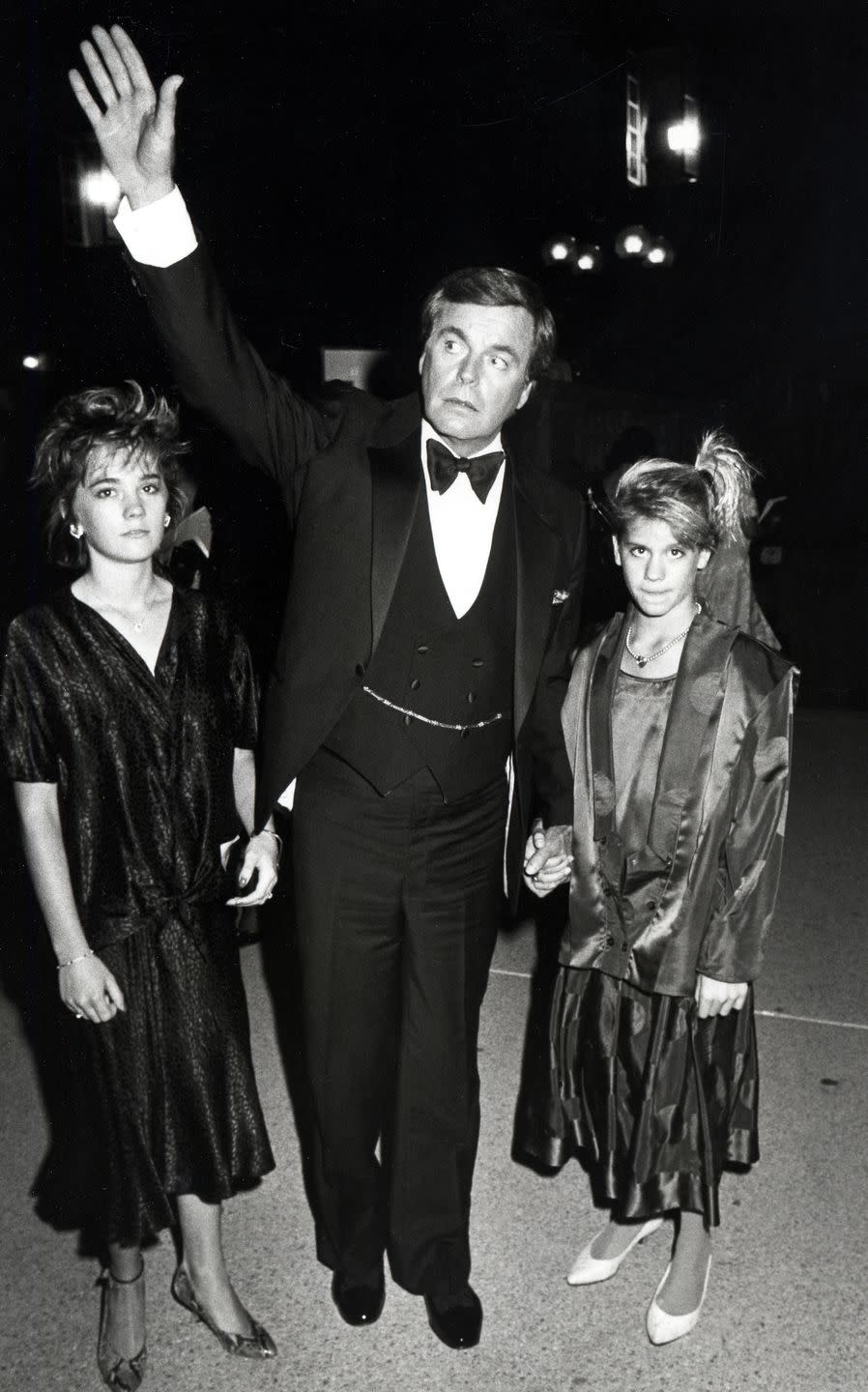 <p>After the tragic death of his wife, Natalie Wood, Robert Wagner was responsible for raising their daughter Natasha Wagner (left). Here, the actor attends the 37th Emmy awards with his daughter and her friend. </p>